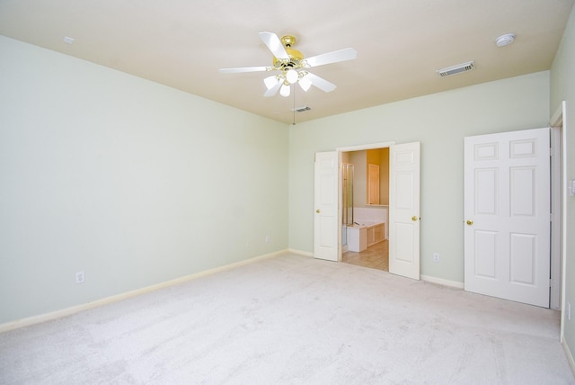 7218 Welshwood Ln, Sugar Land, TX 77479 - unfurnished bedroom featuring light colored carpet, baseboards, ceiling fan, and ensuite bathroom