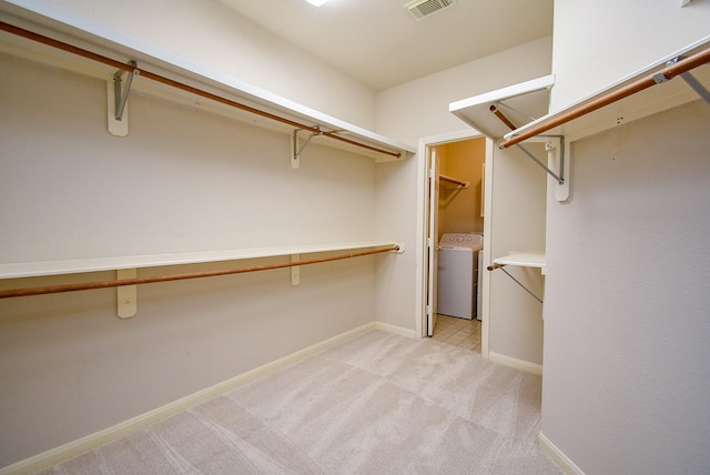 7218 Welshwood Ln, Sugar Land, TX 77479 - walk in closet featuring washer / clothes dryer and light carpet