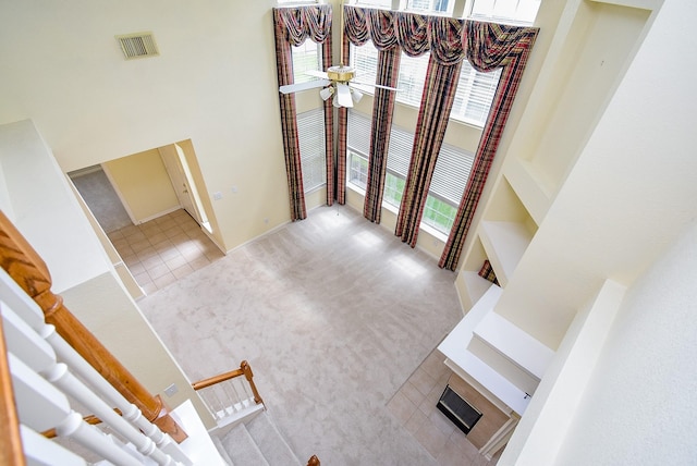 7218 Welshwood Ln, Sugar Land, TX 77479 - tiled foyer entrance featuring a high ceiling, carpet flooring, and ceiling fan