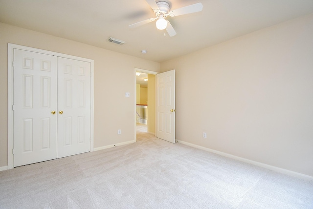 7218 Welshwood Ln, Sugar Land, TX 77479 - unfurnished bedroom with light colored carpet, baseboards, a closet, and a ceiling fan