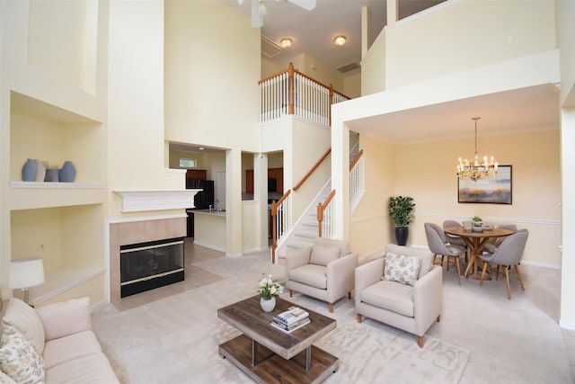 7218 Welshwood Ln, Sugar Land, TX 77479 - living area featuring stairway, light carpet, a chandelier, a towering ceiling, and a tiled fireplace