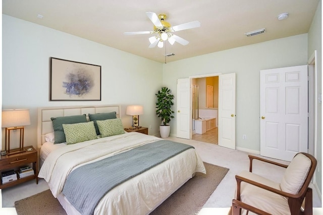 7218 Welshwood Ln, Sugar Land, TX 77479 - bedroom with light colored carpet, a ceiling fan, baseboards, and ensuite bath
