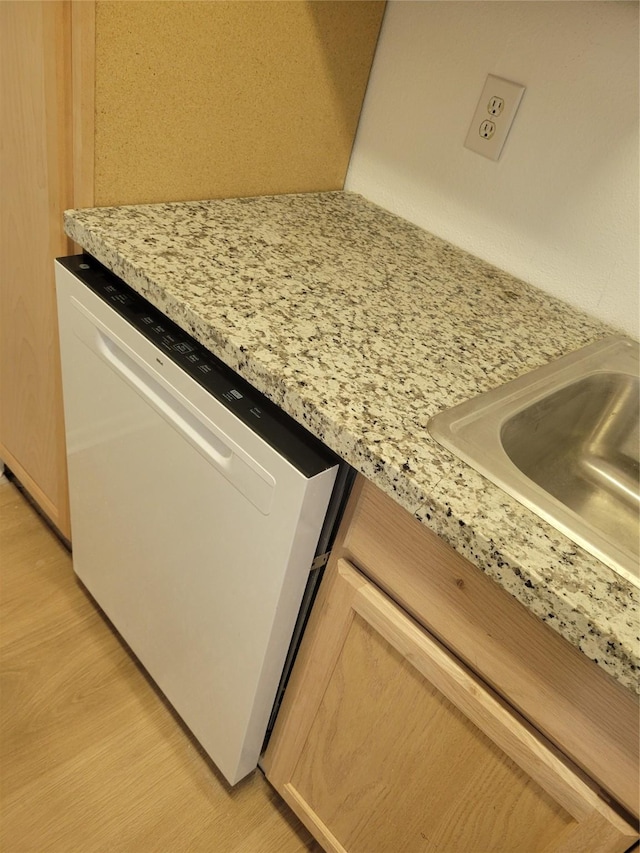 8425 Hearth Dr Unit 25, Houston, TX 77054 - kitchen view of white dishwasher, light wood-style floors, and a sink