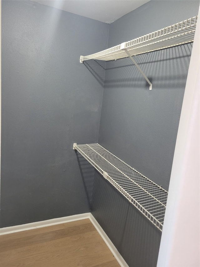 8425 Hearth Dr Unit 25, Houston, TX 77054 - walk in closet featuring wood finished floors