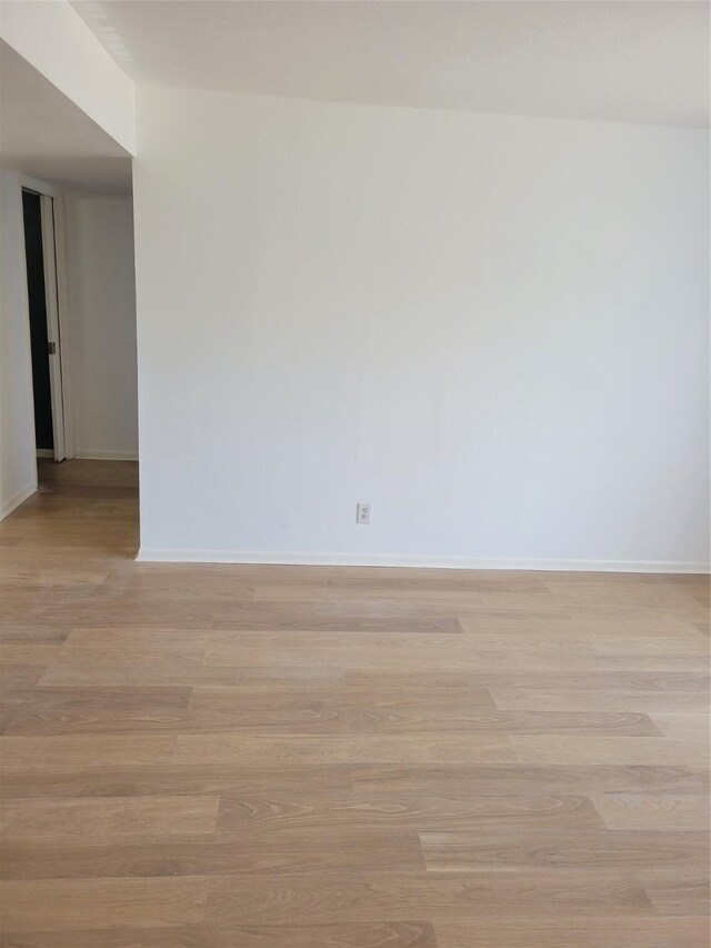 8425 Hearth Dr Unit 25, Houston, TX 77054 - empty room featuring light wood-style floors and baseboards