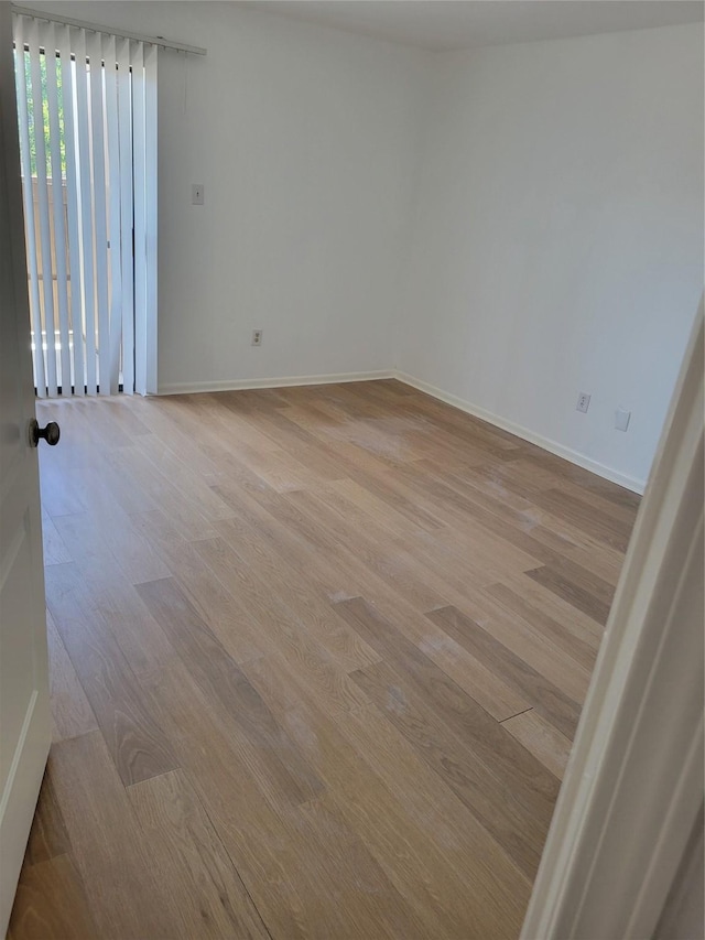 8425 Hearth Dr Unit 25, Houston, TX 77054 - spare room featuring light wood-style flooring and baseboards