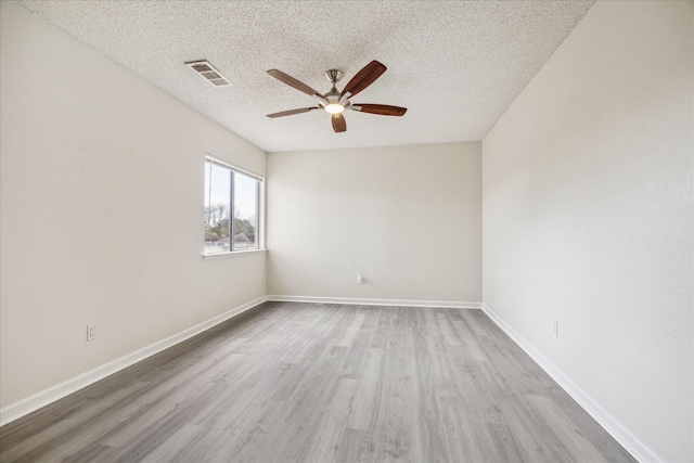 3148 Windchase Blvd Unit 442, Houston, TX 77082 - empty room with a textured ceiling, a ceiling fan, wood finished floors, and baseboards