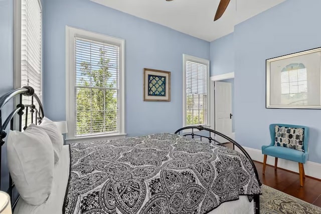 1427 Winnie St, Galveston, TX 77550 - bedroom with wood finished floors, baseboards, and a ceiling fan