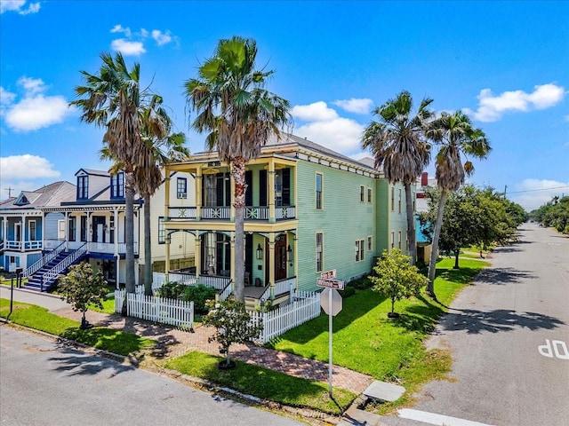 1427 Winnie St, Galveston, TX 77550 - view of front of property featuring a balcony and covered porch