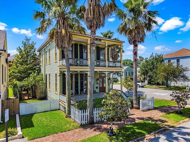 1427 Winnie St, Galveston, TX 77550 - view of front of house featuring a balcony and a porch