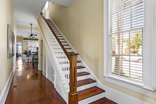 1427 Winnie St, Galveston, TX 77550 - stairs with hardwood / wood-style flooring, a ceiling fan, and baseboards