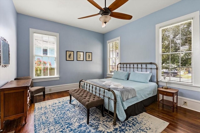 1427 Winnie St, Galveston, TX 77550 - bedroom featuring wood finished floors, baseboards, and a ceiling fan