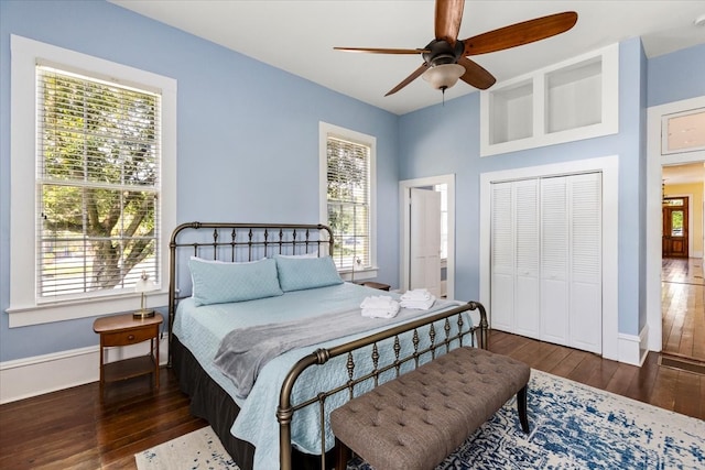 1427 Winnie St, Galveston, TX 77550 - bedroom featuring wood-type flooring, baseboards, a closet, and ceiling fan