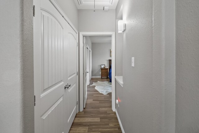 4418 Legends Bay Dr, Baytown, TX 77523 - hall with attic access, dark wood-type flooring, and a textured wall