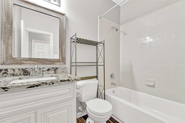 4418 Legends Bay Dr, Baytown, TX 77523 - full bathroom featuring toilet, washtub / shower combination, and vanity