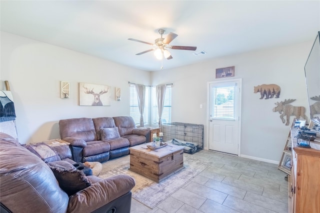 26019 Babe Ruth Dr, Splendora, TX 77372 - living room featuring a ceiling fan and baseboards