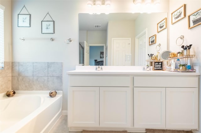 26019 Babe Ruth Dr, Splendora, TX 77372 - full bathroom featuring a garden tub and double vanity