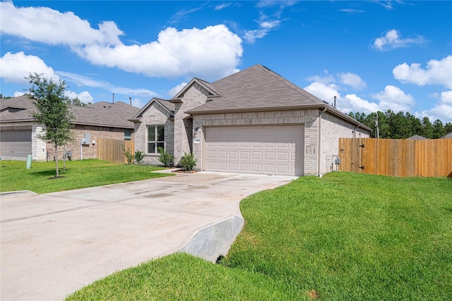 26019 Babe Ruth Dr, Splendora, TX 77372 - view of front of property with brick siding, driveway, an attached garage, and roof with shingles