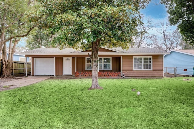 1009 Linden St, La Marque, TX 77568 - ranch-style home with an attached garage, board and batten siding, and driveway