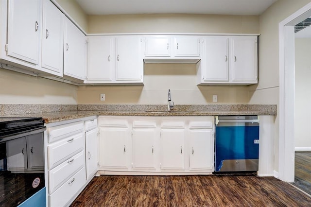 1009 Linden St, La Marque, TX 77568 - kitchen with dishwashing machine, a sink, electric stove, and white cabinetry