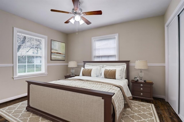 1009 Linden St, La Marque, TX 77568 - bedroom with wood finished floors, baseboards, and a ceiling fan