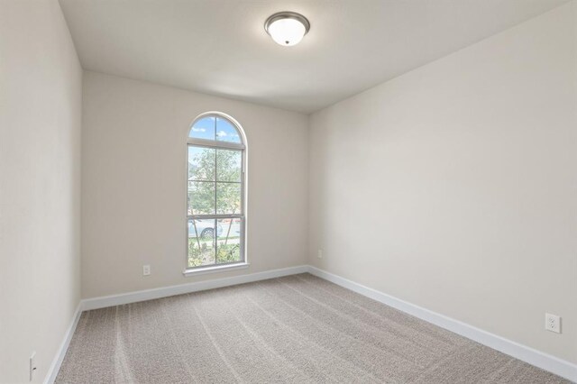 18511 Wolf Mountain Ln, Cypress, TX 77433 - empty room featuring baseboards and carpet flooring