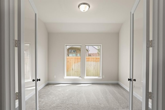 18511 Wolf Mountain Ln, Cypress, TX 77433 - unfurnished room featuring carpet flooring, french doors, and baseboards