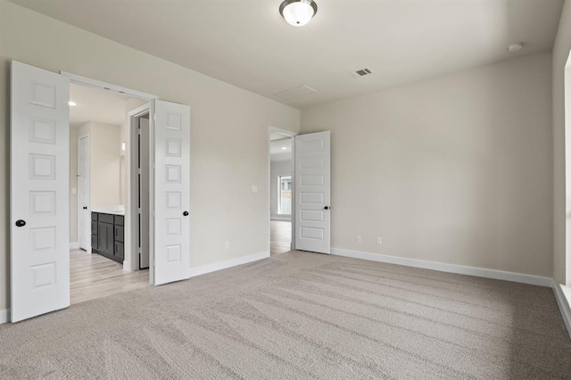 18511 Wolf Mountain Ln, Cypress, TX 77433 - unfurnished bedroom featuring light carpet and baseboards