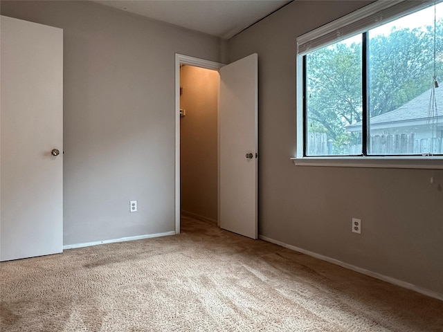 1405 Alma Dr, Austin, TX 78753 - unfurnished bedroom featuring carpet flooring and baseboards