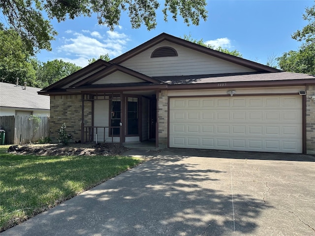 1405 Alma Dr, Austin, TX 78753 - ranch-style home with concrete driveway, a garage, covered porch, and brick siding