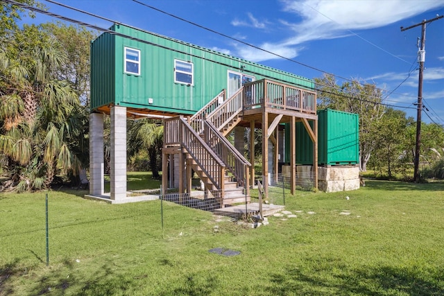 1350 23rd St, San Leon, TX 77539 - rear view of house with stairs, a yard, and a wooden deck