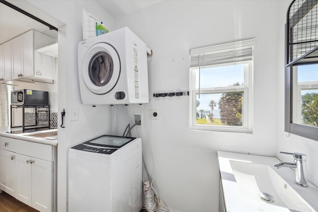 1350 23rd St, San Leon, TX 77539 - laundry room with stacked washer / drying machine