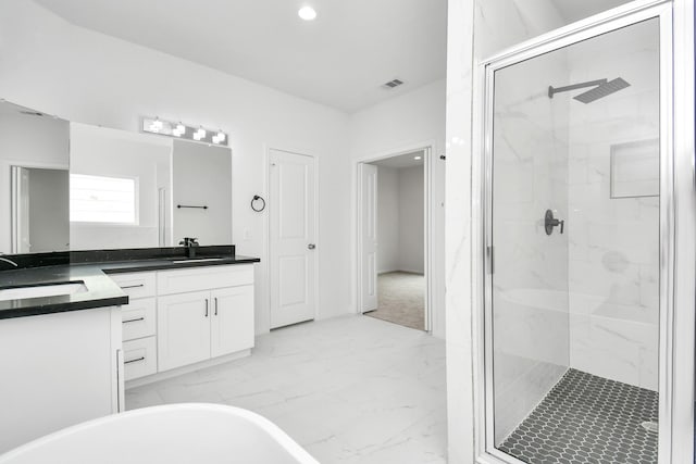 3309 Shelby Cir, Houston, TX 77051 - bathroom with a marble finish shower, marble finish flooring, double vanity, a freestanding bath, and recessed lighting