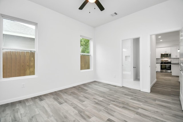 3309 Shelby Cir, Houston, TX 77051 - empty room with a ceiling fan, light wood finished floors, and baseboards