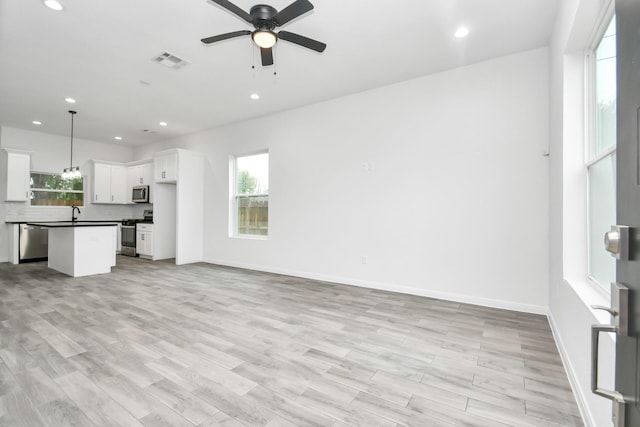 3309 Shelby Cir, Houston, TX 77051 - unfurnished living room featuring recessed lighting, plenty of natural light, ceiling fan, and baseboards