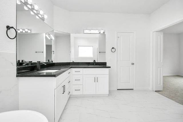 3309 Shelby Cir, Houston, TX 77051 - bathroom featuring marble look tile flooring, double vanity, and a freestanding bath