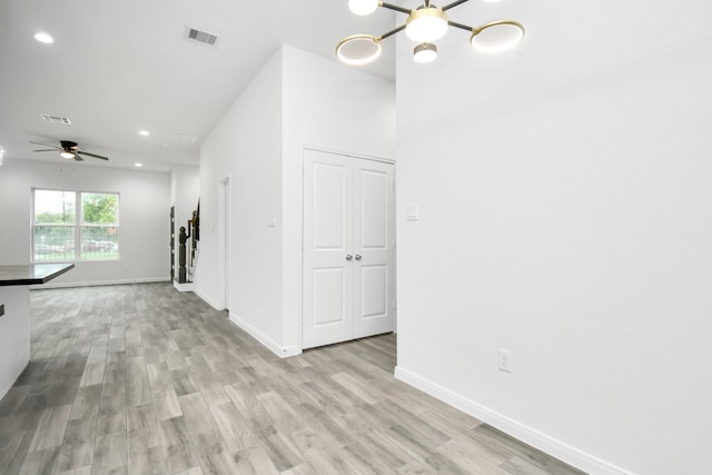 3309 Shelby Cir, Houston, TX 77051 - unfurnished living room with a chandelier, light wood-style floors, recessed lighting, baseboards, and ceiling fan
