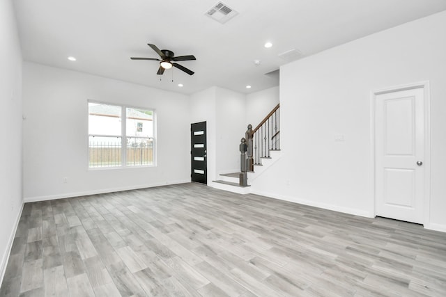3309 Shelby Cir, Houston, TX 77051 - unfurnished living room featuring ceiling fan, stairway, light wood-type flooring, baseboards, and recessed lighting