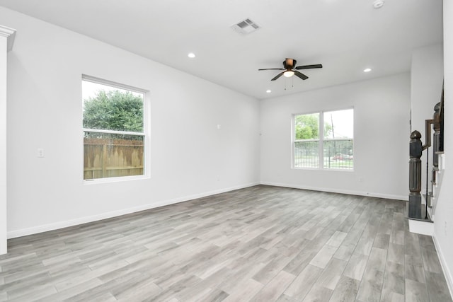 3309 Shelby Cir, Houston, TX 77051 - unfurnished living room featuring a ceiling fan, light wood-style flooring, recessed lighting, baseboards, and stairs