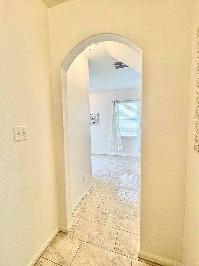 5723 Treasure Cove Rd, Cove, TX 77523 - hall with arched walkways and baseboards