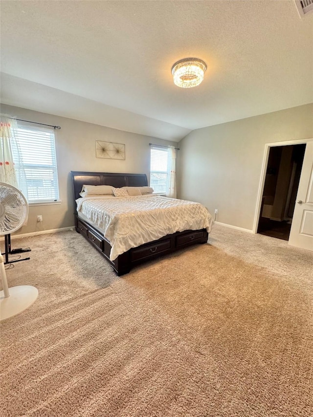 5723 Treasure Cove Rd, Cove, TX 77523 - carpeted bedroom with baseboards and a textured ceiling