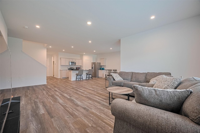 40434 Basalt Elm Rd, Magnolia, TX 77354 - living area with light wood-style flooring and recessed lighting