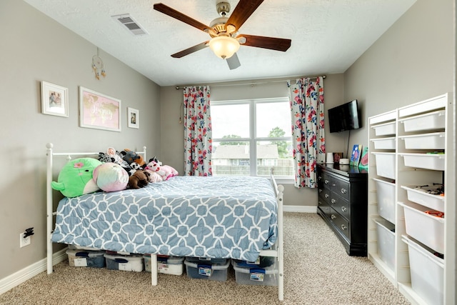 2550 Lakeside Dr, West Columbia, TX 77486 - bedroom featuring light carpet, baseboards, a textured ceiling, and a ceiling fan