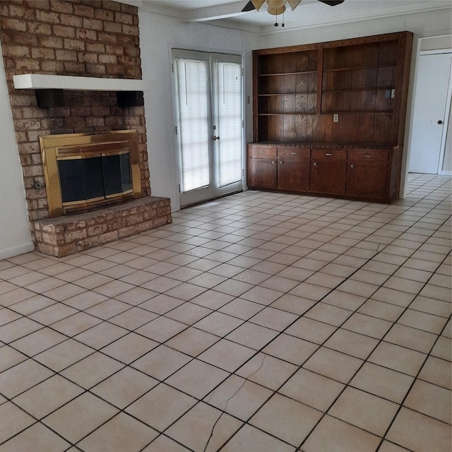 1415 Scenic Ridge Dr, Houston, TX 77043 - unfurnished living room featuring a ceiling fan, a brick fireplace, light tile patterned floors, and french doors
