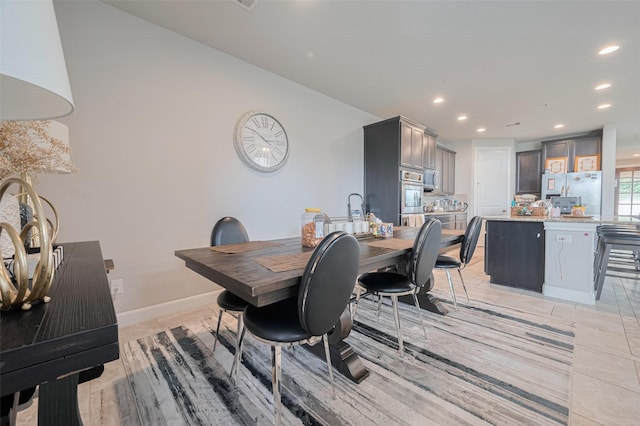 4335 Thornapple Hills Ct, Richmond, TX 77406 - dining space featuring recessed lighting, baseboards, and light tile patterned floors