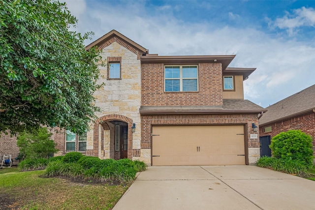 4335 Thornapple Hills Ct, Richmond, TX 77406 - view of front of property featuring stone siding, an attached garage, concrete driveway, and brick siding