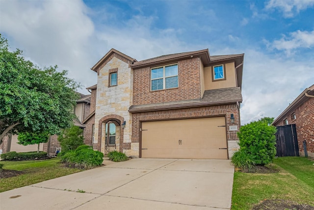4335 Thornapple Hills Ct, Richmond, TX 77406 - view of front facade with stone siding, an attached garage, concrete driveway, and brick siding