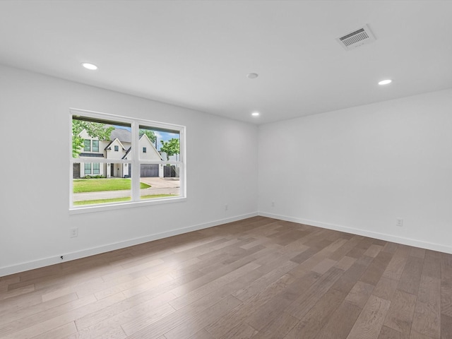 1208 Curtin St, Houston, TX 77018 - spare room featuring wood finished floors, recessed lighting, and baseboards