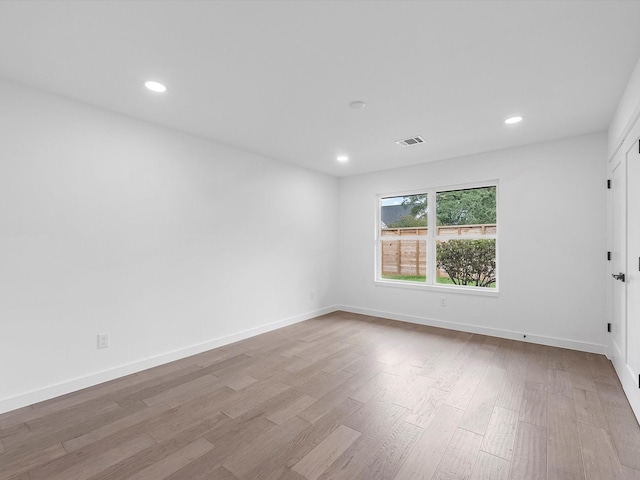 1208 Curtin St, Houston, TX 77018 - unfurnished room featuring wood finished floors, recessed lighting, and baseboards
