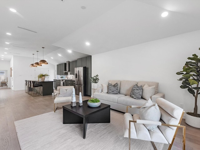 1208 Curtin St, Houston, TX 77018 - living room featuring light wood-style flooring, lofted ceiling, and recessed lighting